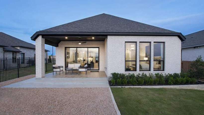 Design 1984W · Covered Outdoor Living Patio Surrounded by Bastrop Pines